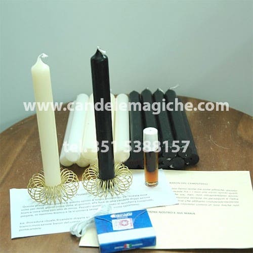 una candela bianca ed una nera per invocare il rituale del baron del cimitero