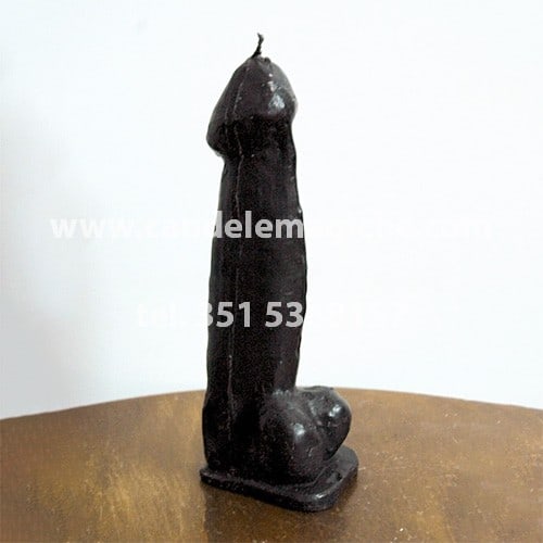 candela a forma di fallo nero